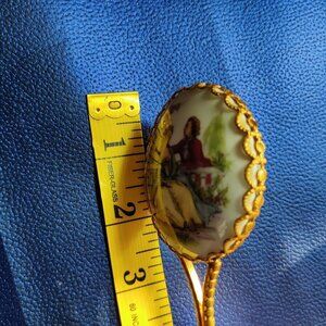 Limoge miniature handheld mirror with walleau inspired painted couple courting.